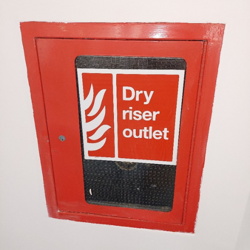 Photograph of a typical dry riser outlet on each floor of Harlequin Lodge.