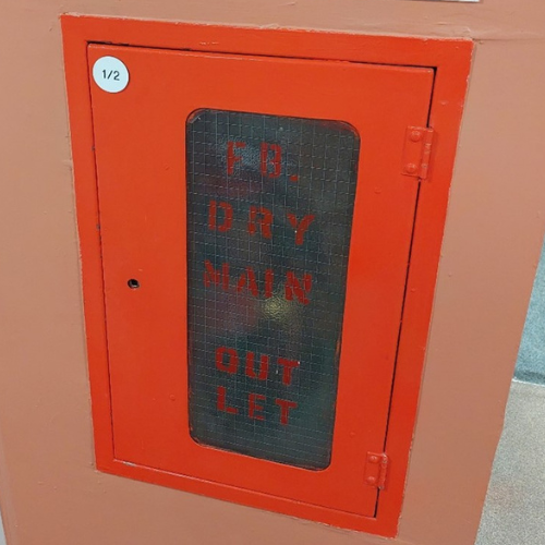 Photograph of a typical dry riser outlet on each floor of Tom Collins House.